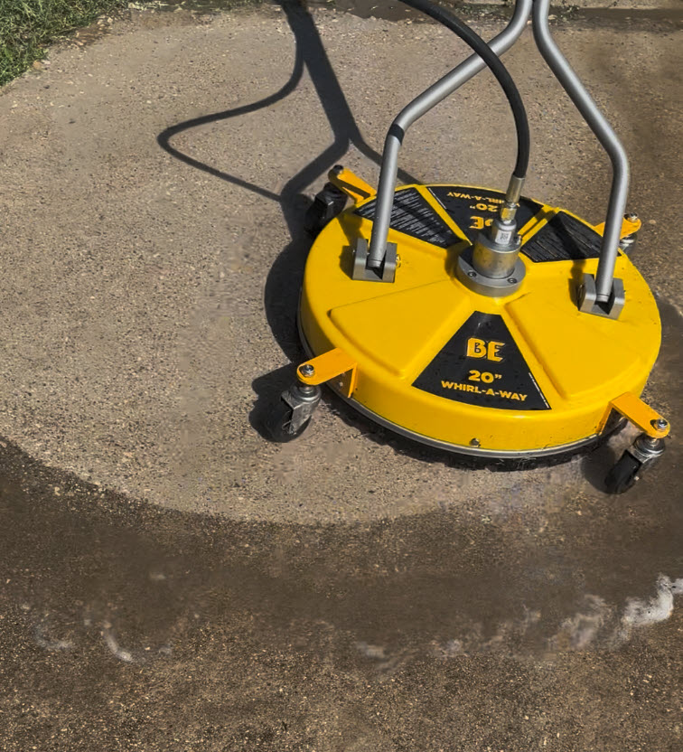 Pressure washing exterior of a residential property in North Texas to remove dirt and grime